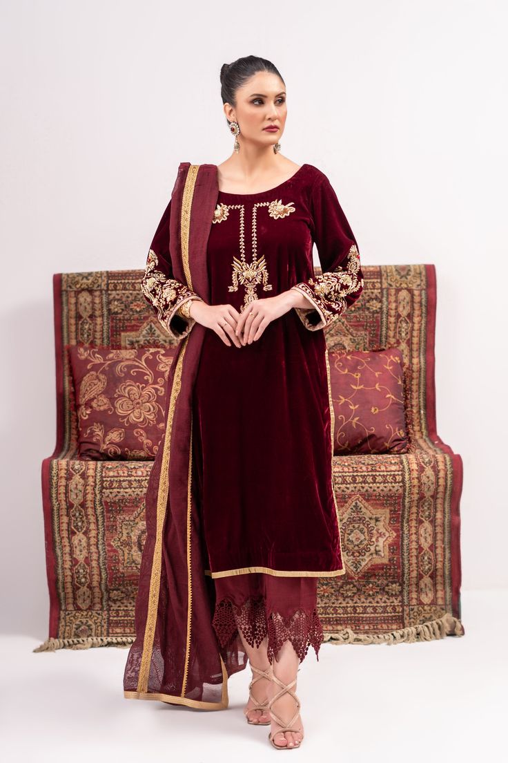 A deep red velvet suit with traditionally inspired full hand embroidery and emphasized with kora and nakshi work. Paired with a khadi silk dupatta with gota work lines on it and a velvet pajama with silk work on the bottom.3-piece suitReady-to-wear Red Sharara With Naqshi For Eid, Red Raw Silk Traditional Wear With Naqshi, Elegant Red Anarkali Set With Naqshi Detailing, Elegant Red Anarkali Set With Naqshi, Red Sets With Dabka For Traditional Ceremonies, Red Sharara With Naqshi In Traditional Drape, Red Unstitched Sharara With Naqshi Detailing, Red Naqshi Sharara With Traditional Drape, Velvet Traditional Wear With Dabka Work