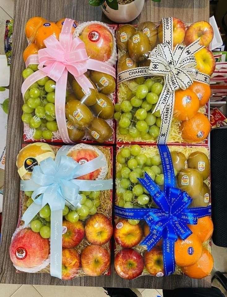 an assortment of fruits and vegetables wrapped in ribbon