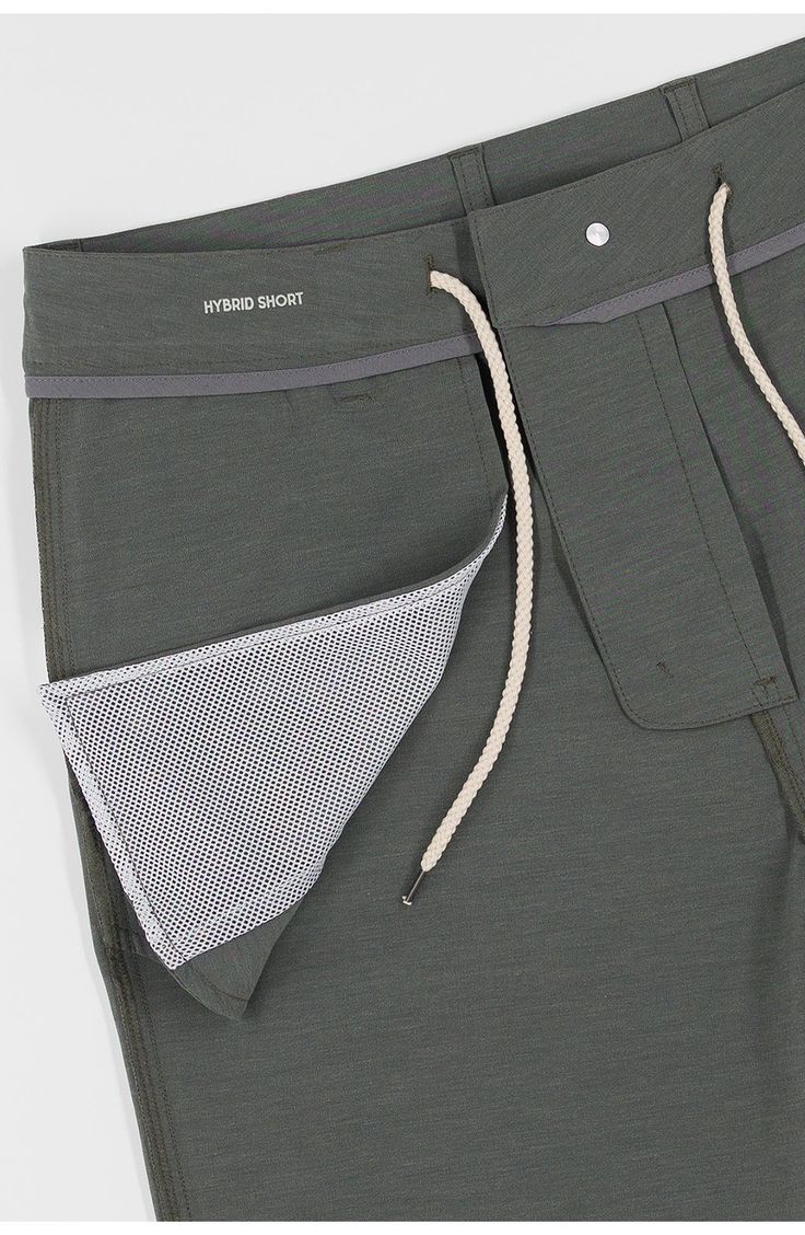 With the look of flat-front chinos and the performance features of swimwear, these hybrid shorts easily take you from the beach to the bar and beyond. The quick-drying technical fabric is made with recycled fibers, plenty of stretch and a hint of cotton for softness. 8" inseam; 10 1/2" front rise Zip fly with button closure; interior drawcord Front slant pockets; back-zip welt pockets Four-way-stretch fabric Mesh pocket linings 75% recycled polyester, 17% cotton, 8% spandex Machine wash, tumble 4-way Stretch Shorts With Drawstring For Outdoor, Outdoor Shorts With Functional Drawstring And 4-way Stretch, Athleisure Swim Trunks With Pockets And 4-way Stretch, Functional 4-way Stretch Swim Trunks With Pockets, Midweight Moisture-wicking Shorts For Summer, 4-way Stretch Swim Trunks For Outdoor, Midweight Shorts With Pockets For Summer, Summer Midweight Shorts With Pockets, Moisture-wicking Midweight Athletic Shorts For Summer