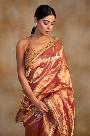 Pink and gold silk tissue chanderi saree finished with kiran lace border detailing. Comes with an unstitched blouse piece. - Aza Fashions Gold Chanderi Pre-draped Saree With Gota Work, Gold Pre-draped Saree With Sheer Dupatta For Navratri, Transitional Gold Pre-draped Saree With Gota Work, Gold Pre-draped Dola Silk Saree With Dupatta, Gold Pre-draped Saree With Cutdana For Navratri, Gold Cotton Silk Pre-draped Saree, Bollywood Pre-draped Saree With Sheer Dupatta For Puja, Festive Gold Pre-draped Cotton Silk Saree, Gold Pre-draped Saree With Gota Work