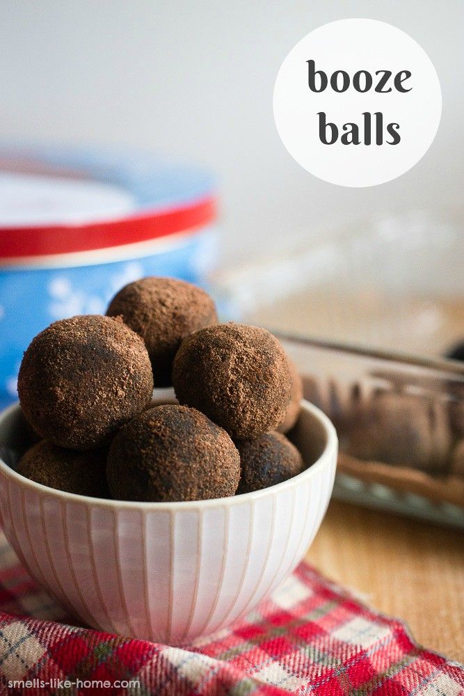 a bowl filled with chocolate truffles on top of a table