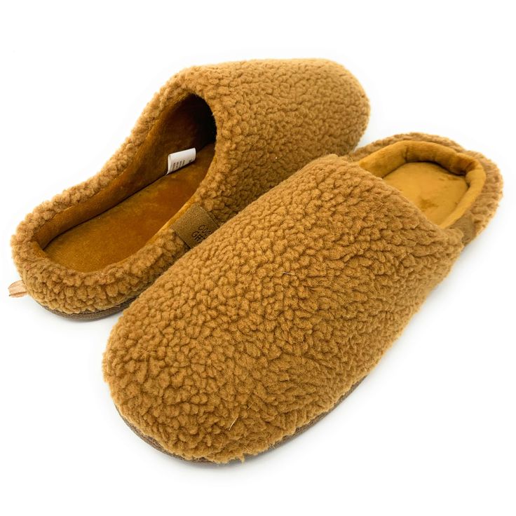 Lounge in style with these super soft men's slip-on slippers from our partners at Oooh Geez! Slippers. Stay warm & look great with your new red or orange slip-on slippers. Wear them around the house or out and about thanks to the non-skid rubber bottom. Pick up a pair today! Info Style: Slip-on fashion slipper with non-skid rubber bottom sole. Size: Medium fits men's U.S. shoe size 9-10Large fits men's U.S. shoe size 11 - 12 Material: 100% super soft Sherpa Care: Machine wash cold with no bleach Cozy Outdoor Slip-on Slippers, Brown Slip-on Slippers With Stitched Sole, Brown Slip-on Slippers With Textured Sole, Luxury Men's Slip-on Slippers, Men’s House Slippers, Designer Slippers, Fashion Slippers, Fuzzy Slippers, Sock Animals