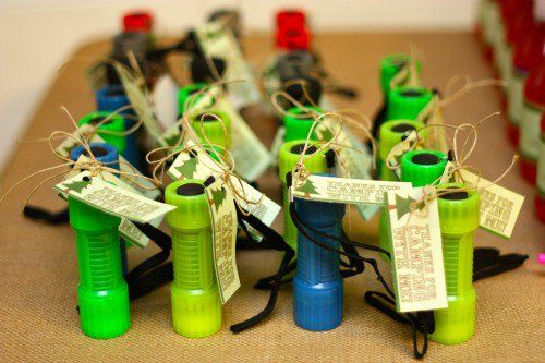 several green and blue bottles with tags tied to them