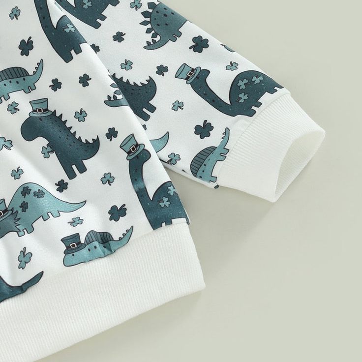 Outfit your little one in RAWR-some style with this cuddly teal dino set! Not only will they look so cute, but this set will keep them cozy while they explore the world. Cotton Long Sleeve Dinosaur Print Set, Cotton Long Sleeve Sets With Dinosaur Print, Casual Green Dinosaur Print Sets, Casual Green Sets With Dinosaur Print, Blue Dinosaur Print Top For Playtime, Playful White Dinosaur Print Sets, Teal Outfit, Teal Outfits, Explore The World