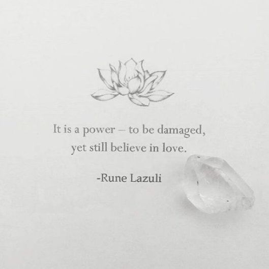 a white piece of paper with a quote on it and a flower in the middle