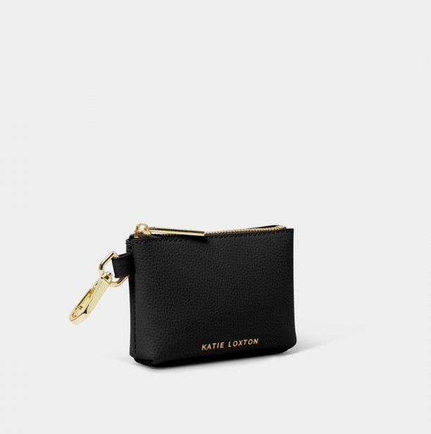 Introducing our Evie Clip On Coin Purse, the perfect accessory for those who value both fashion and functionality. Crafted from soft vegan leather and accented with gold-tone hardware and logo, this coin purse is both stylish and practical. The snap-hook design allows for easy attachment to any handbag, making it the perfect accessory for on-the-go professionals. Designed to complement our matching Evie Crossbody Bag. Coin Organizer, Hook Design, Coin Wallet, Star Spangled, Purse Black, Summer Blue, Gift Boutique, Clothes Gift, Clip On