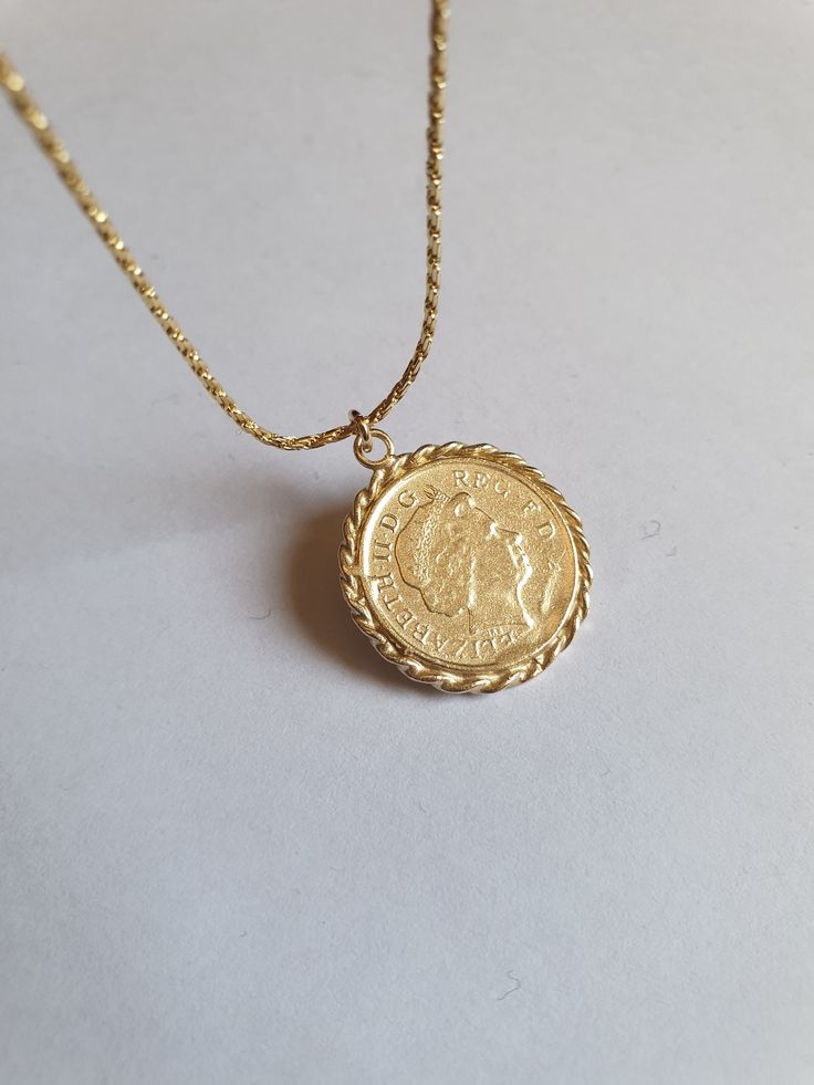 Solid gold coin necklace, gold coin pendant necklace, antique necklace, British coin gold necklace, 14k gold necklace Solid gold 14k necklace with an old british gold coin pendant, great for everyday wear, unique and beautiful. The chain is made of 14k solid gold and available in a few styles and lengths and the pendant is an original coin which I decorate with twisted gold wires and is available in 9k or 14k solid gold. Dimensions: The coin pendant's diameter is about 0.75 inch (2 cm). There ar Yellow Gold Pendant Coin Necklace Stamped 14k, Yellow Gold Coin Necklace Pendant 14k Stamped, Vintage Yellow Gold Coin Necklace, Tarnish Resistant, 14k Yellow Gold Coin Pendant Necklace, 14k Stamped Yellow Gold Coin Pendant Necklace, Vintage Yellow Gold Round Coin Necklace, Vintage Yellow Gold Tarnish Resistant Medallion Necklace, Vintage Yellow Gold Tarnish-resistant Medallion Necklace, Tarnish-resistant Yellow Gold Coin Necklace