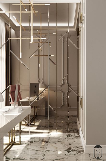 the interior of a modern office with marble flooring and gold accents on the walls