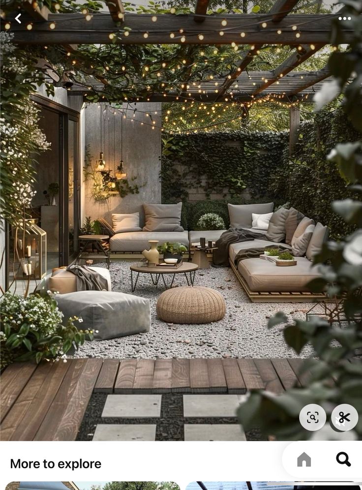 an outdoor living room with lots of furniture and lights on the ceiling is featured in this instagram