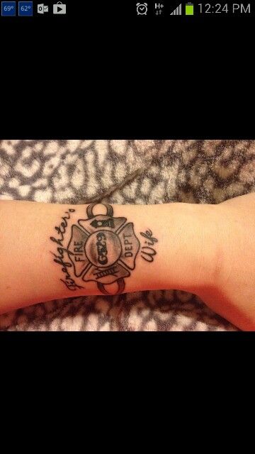 a person's arm with a tattoo on it and the words, fire department