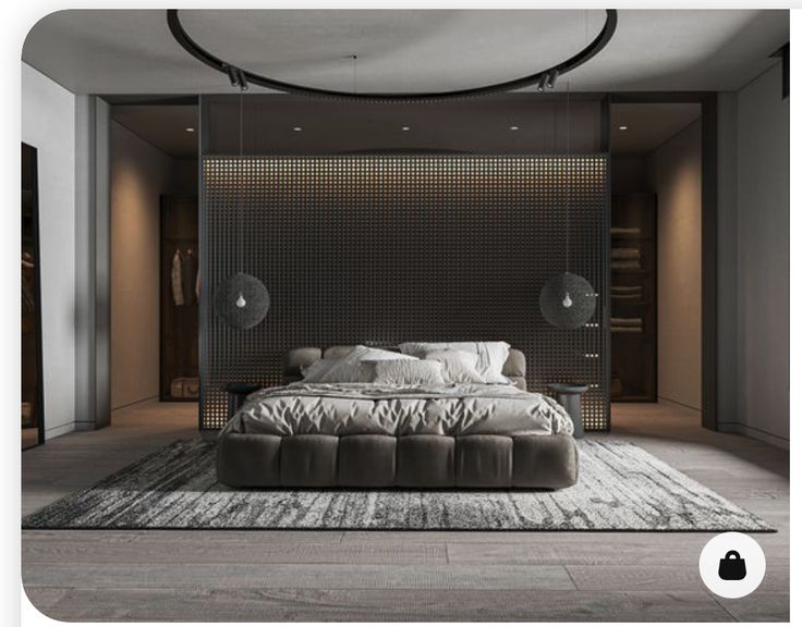 a large bed sitting in the middle of a room next to a wall mounted fan