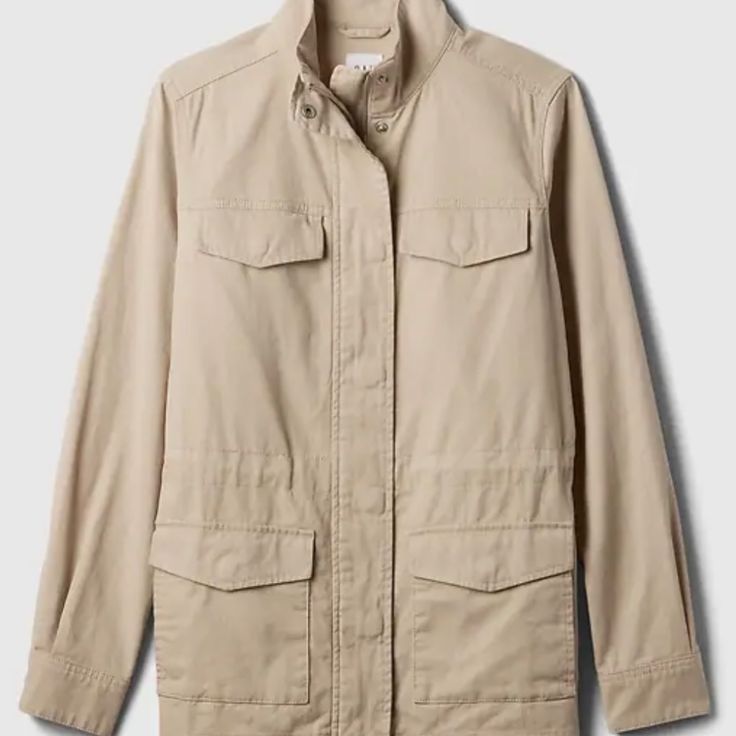 Versatile And Durable Canvas Utility Jacket In A Chic Sand Khaki Color. Designed With A Straight Silhouette And Easy Fit, This Jacket Falls Just Below The Hip. Crafted From Smooth Canvas Weave, It Features Long Sleeves With Snap Cuffs, A Stand Collar, And A Snap-And-Zip Front Closure. Practical Patch Pockets At The Chest And Hem Add To Its Utility. Made From 100% Conventional Cotton. Machine Washable. Imported. Gap Outerwear For Fall Layering, Gap Long Sleeve Outerwear For Layered Wear, Gap Spring Utility Jacket With Pockets, Gap Outerwear For Fall Workwear, Gap Utility Jacket With Pockets, Gap Utility Jacket With Pockets And Long Sleeves, Gap Long Sleeve Utility Jacket With Pockets, Gap Long Sleeve Spring Utility Jacket, Gap Long Sleeve Outerwear For Spring