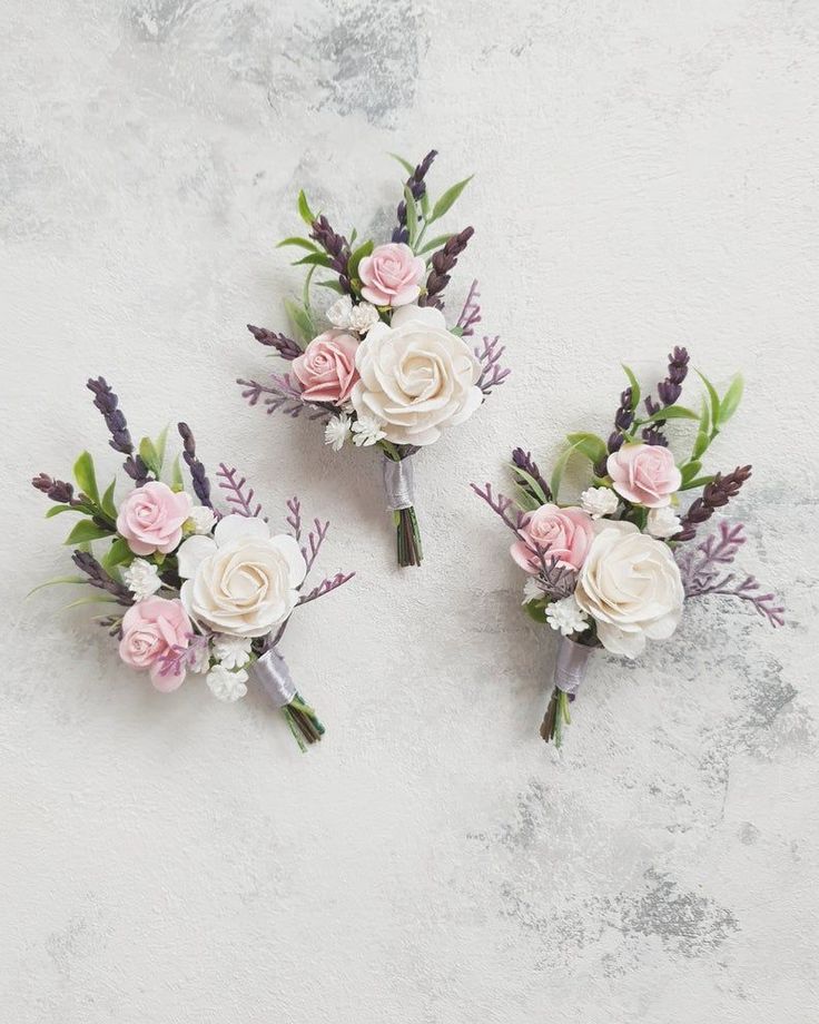 three flowers are placed on top of each other in the shape of bridal bouquets