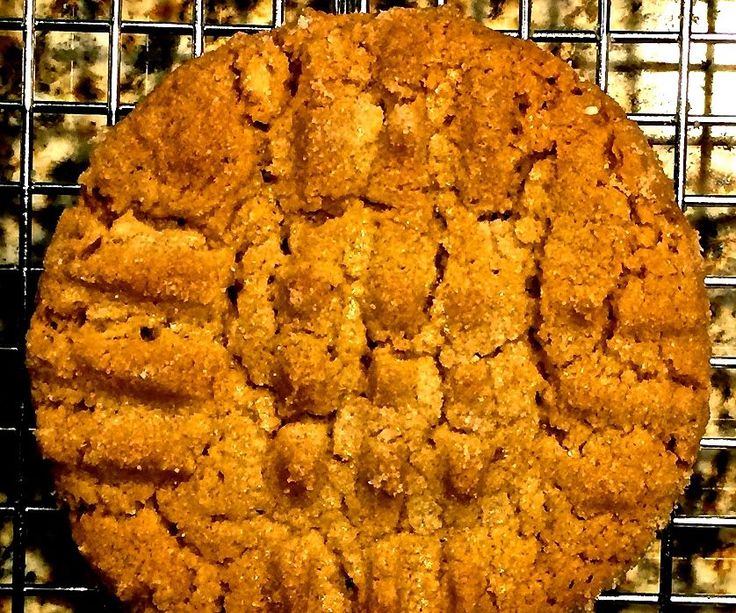 a cookie sitting on top of a cooling rack