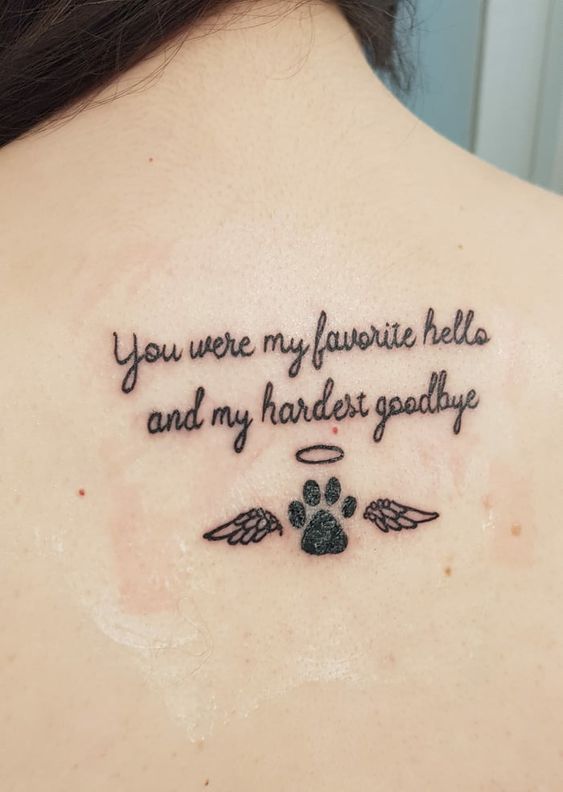 a woman with a tattoo on her back saying you were my favorite hello and my harder goodbye