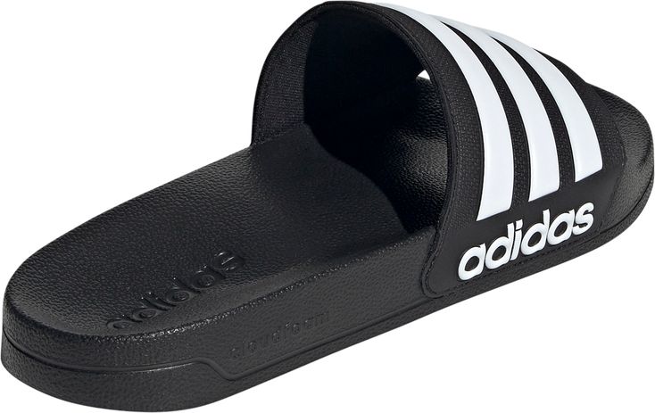 SHOWER SLIDES FOR VERSATILE COMFORT.From the pool deck to the shower to the couch, these slides are made for the work-hard-rest-hard lifestyle. The slip-on construction gives you a snug fit that's easy to kick on and off as needed. Lightweight cushioning keeps your feet cradled in all-day comfort. The adidas logo and 3-Stripes design complete the iconic Adilette style.Features: Regular fit Slip-on construction Synthetic upper Textile lining Contoured footbed Cloudfoam midsole Synthetic outsole Adidas Sandals, Shower Sandals, Adidas Slides, Shower Shoes, Black Slides, Best Shoes For Men, Adidas Adilette, Outdoor Sandals, Sport Sandals