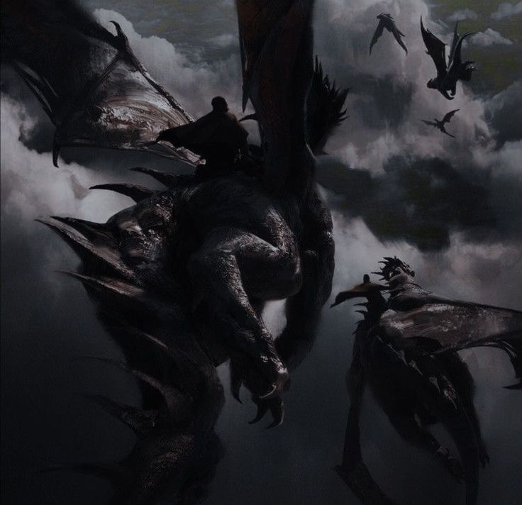 two large black dragon flying through the sky with people on it's back in front of them