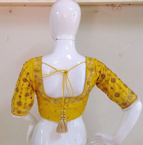 Pure raw silk blouse with maggam work on neck sleeves and back neck. Custom fitted. -Measurements sheet will be sent to you once you order( Standard sizing also available) -Custom colors available -Work on front back and sleeves. Yellow Silk Blouse With Dori Work, Yellow Silk Blouse Piece With Dori Work, Yellow Silk Blouse With Resham Embroidery, Yellow Silk Blouse With Traditional Drape, Fitted Silk Top With Handwork, Bollywood Style Yellow Blouse For Wedding, Bollywood Style Yellow Wedding Blouse, Yellow Semi-stitched Blouse With Dori Work, Silk Blouse Piece With Handwork Fitted