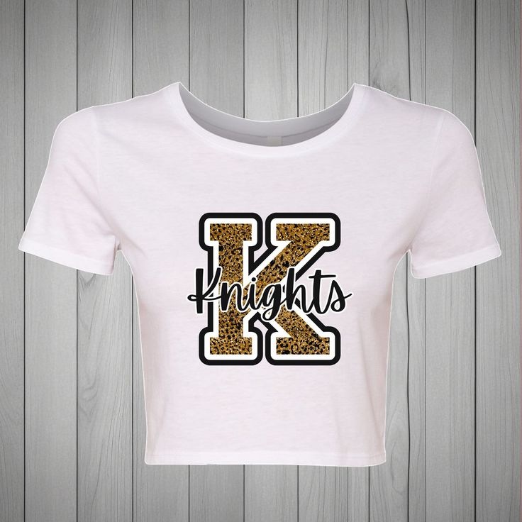 Bella + Canvas Form-fitting Crop 3.6 oz./yd² Airlume combed and ring-spun cotton/polyester, 40 singles Pre-shrunk XS/S or M/L Choose from 3 Different K designs. Fitted School Spirit T-shirt With Letter Print, Fitted T-shirt With Letter Print For School Spirit, Fitted Pre-shrunk College T-shirt, Fitted Pre-shrunk T-shirt For College, Ucf Knights, College Tees, Cruise Shirt, Black Ombre, Fall Collections