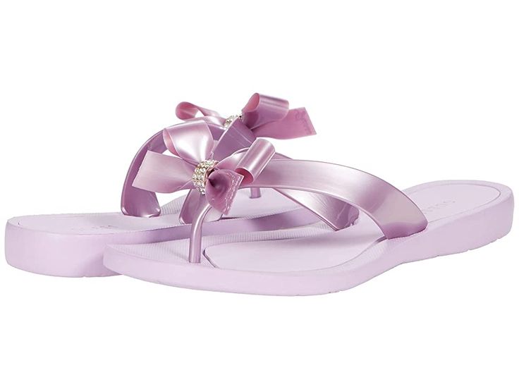 GUESS Tutu - Women's Sandals : Medium Pink : Put a charming spin on your girlie look with these adorable GUESS Tutu sandals! Thong-style construction with rounded toe post. Man-made upper with ultrafeminine bow detail and rhinestone accents. Man-made lining with a lightly cushioned man-made footbed. Flexible rubber outsole. Measurements: Heel Height: 3 4 in Weight: 3 oz Product measurements were taken using size 8, width M. Please note that measurements may vary by size. Weight of footwear is ba Pink Bow Sandals With Synthetic Material, Pink Synthetic Sandals With Bow, Feminine Synthetic Sandals With Bow, Pink Feminine Sandals With Bow, Feminine Pink Sandals With Bow, Pink Bow Sandals For The Beach, Pink Flat Sandals With Bow, Pink Beach Sandals With Bow, Elegant Beach Sandals With Bow