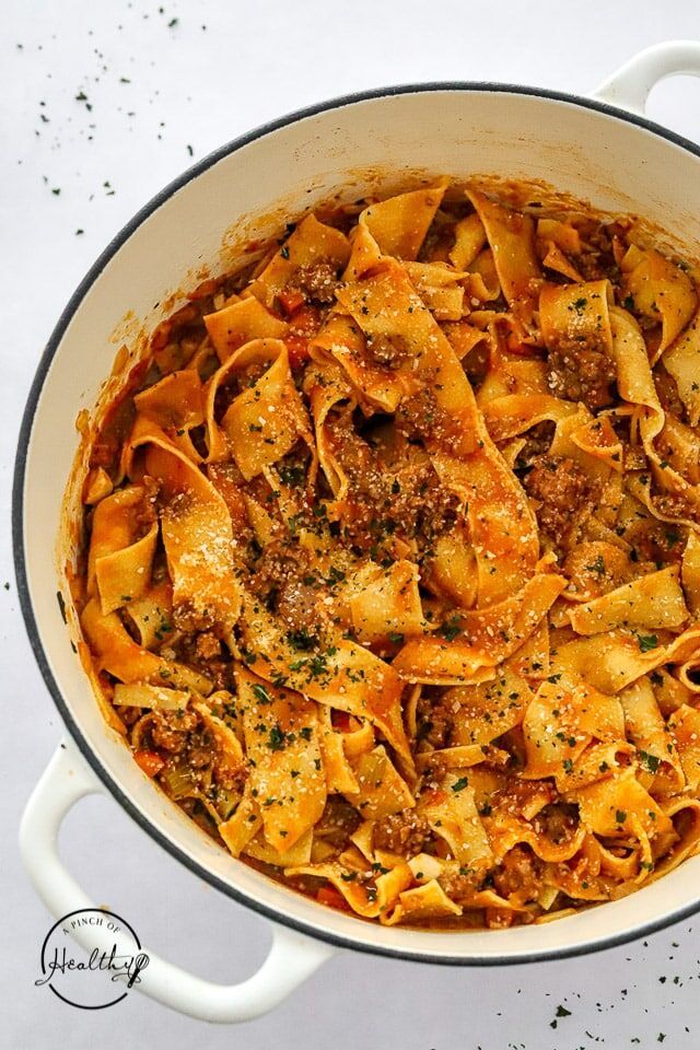 a pot filled with pasta and meat sauce