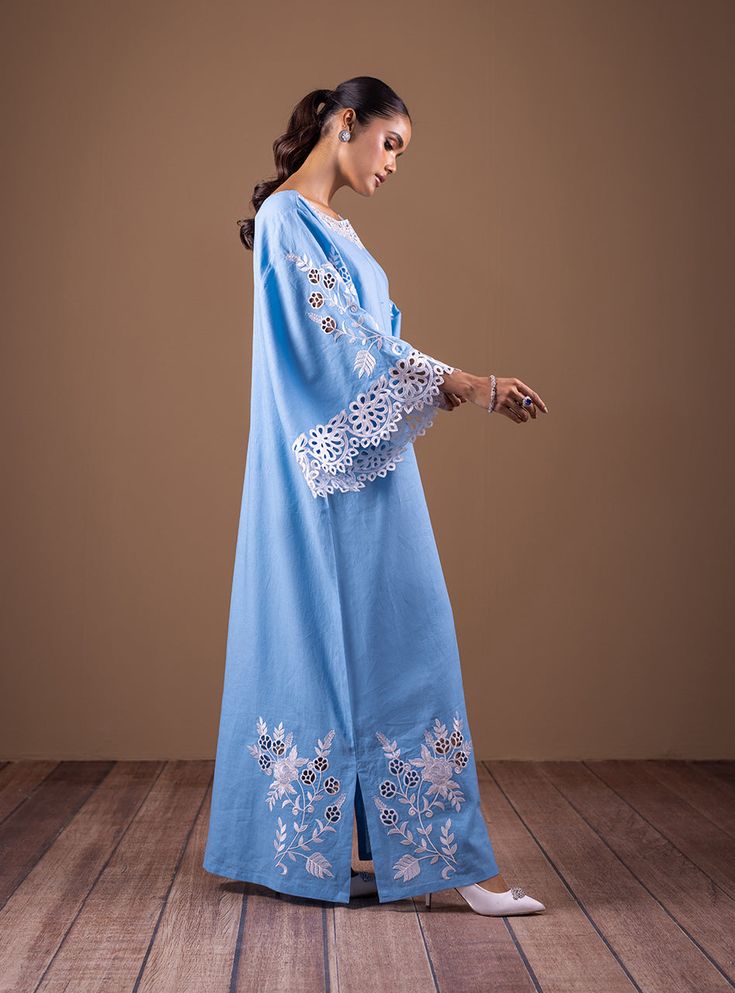 Timeless Blue Light Blue Chikankari Embroidery Dress, Eid Long Sleeve Dress With Cutwork, Long Sleeve Cutwork Dresses For Eid, Elegant Floral Embroidered Tunic Kaftan, Long Sleeve Dresses With Cutwork For Eid, Blue Chikankari Embroidery Kaftan For Eid, Blue Kaftan With Chikankari Embroidery For Eid, Elegant Chikankari Embroidery Kaftan For Eid, Blue Traditional Dress With Lace Work