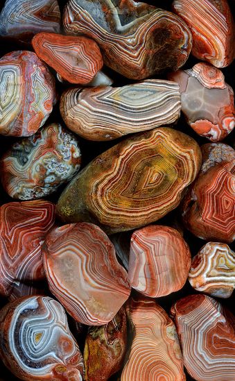 many different colored rocks stacked on top of each other