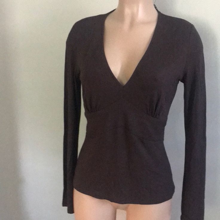 Deep Brown Color. Fitted Under Breast. Long Sleeve. Ties In Back But Could Be Removed Easily. 18” Armpit To Armpit 24” In Length . Tags Attached. Basic Fitted V-neck Top, Cotton Fitted Top For Fall, Tan Long Sleeve Tops For Spring, Fitted V-neck Basic Tops, Fitted Cotton V-neck Top, Fitted Tan T-shirt For Spring, Fitted V-neck Cotton Top, Tan Cotton Tops For Fall, Fitted V-neck T-shirt For Fall