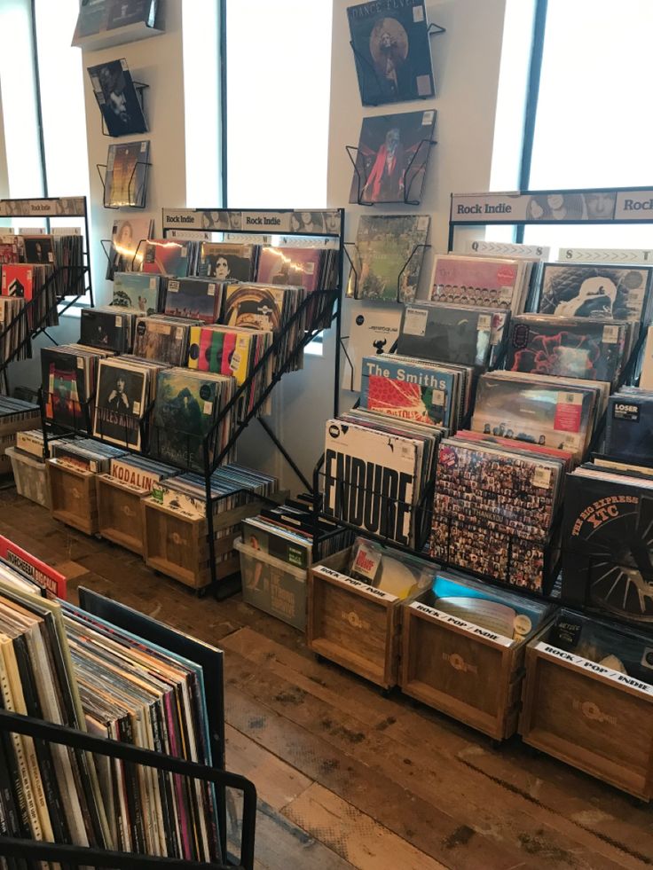 there are many records on display in this room and one is full of vinyls