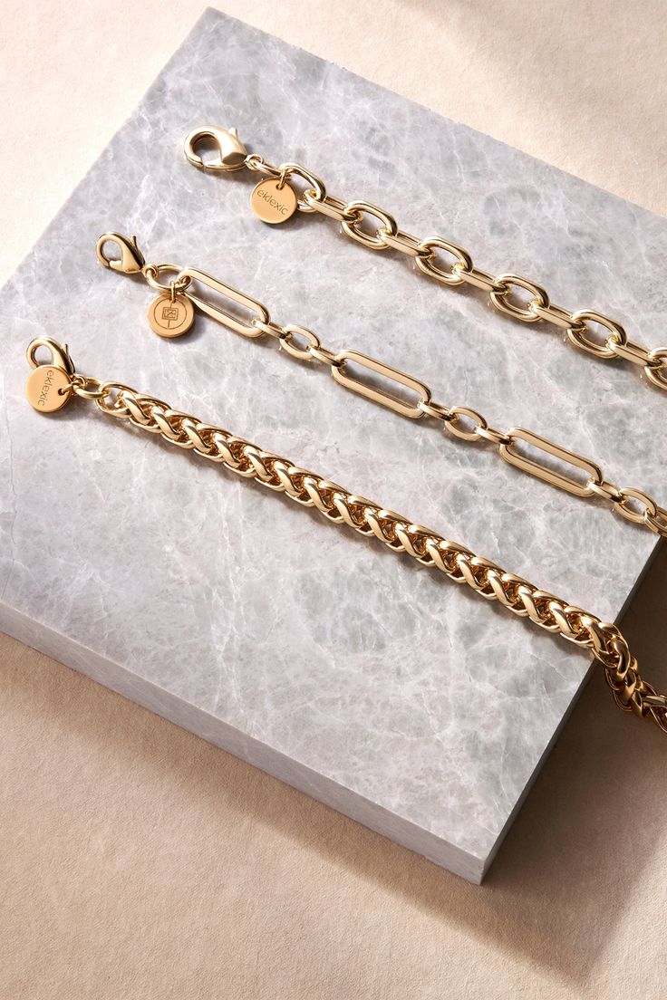 The Esmé bracelet is made from our thick chopin chain and fastened with a with lobster clasp. Material: Recycled Brass Plating: 14K Gold or Rhodium-silver Chain has a clear protective coating to prevent from quick wear and tarnishing. Chain measures: 7mm wide Clasp Measures: 15mm Available in the following Lengths: 6.5", 7", 8", 8.5", 9" Bracelet is handmade in the USA Timeless Chain Link Bracelet With Lobster Clasp, Timeless Link Bracelets With Chunky Chain, Classic Oval Link Chain Bracelets, Everyday Cuban Link Chain Bracelet With Solid Links, Classic Oval Link Chain Charm Bracelet, Timeless Chunky Link Chain Bracelet, Timeless Link Bracelet With Chunky Chain, Classic Metal Bracelets With Cable Chain, Timeless Chunky Chain Link Bracelet