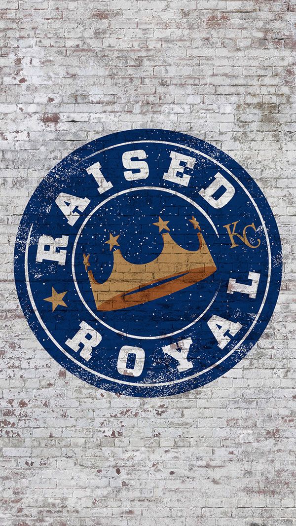 a sign on the side of a brick building that says raised royal with a crown and stars