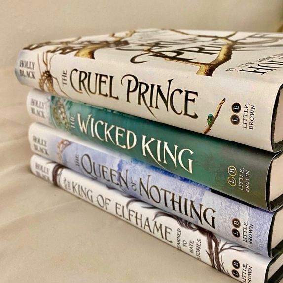 three books stacked on top of each other in front of a white wall with the words cruel prince written on them