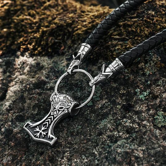 Wolf Head Mjölnir, Black Leather– Grimfrost Black Viking Metal Jewelry, Black Viking Jewelry For Outdoor, Black Viking Style Outdoor Jewelry, Black Viking Style Jewelry For Outdoor, Black Viking Engraved Jewelry, Medieval Black Metal Necklace, Medieval Style Black Metal Necklace, Medieval Black Jewelry For Larp, Medieval Black Pendant Jewelry