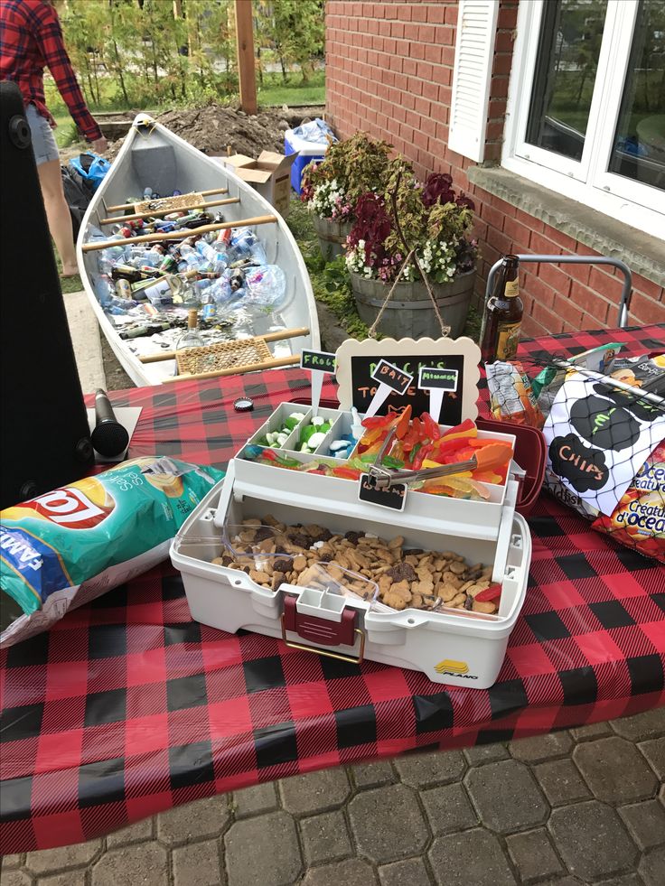 a picnic table with food and snacks on it