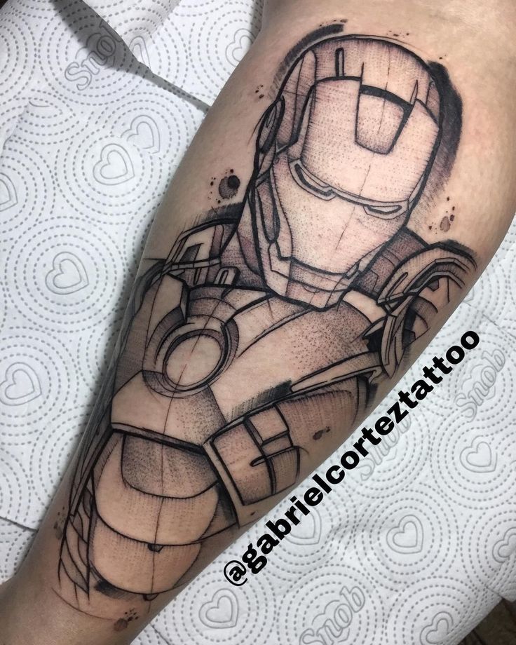 a man's leg with a drawing of iron man on it and his arm