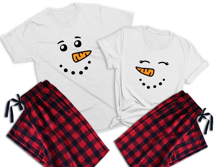 two t - shirts with faces drawn on them, one is red and the other is white