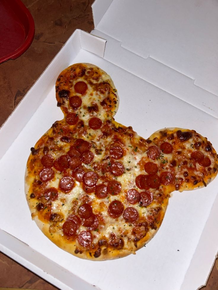 a mickey mouse shaped pizza in a box