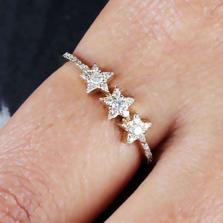 ❂ This ring made with natural diamonds in 14k yellow gold, ❂ Pave Diamond Three Star Ring Solid Gold Jewelry. ❂ Diamond Ring, Star Ring, Gold Ring, Everyday Jewelry ❂ Special customize for Mother's day, Anniversary, Birthday Gift, Valentine, Christmas. ❂ Item Details: Gross Weight: 2.05 Grams 14k Yellow Gold Weight: 2.00 Grams Diamond Weight: 0.25 Carats Item Size: US 7 Item SKU: ZR-2701 Gemstone color may vary due to natural and availability. This is a made to order design. Please allow 7-10 da Celestial Jewelry With Brilliant Cut For Anniversary, Celestial Style Jewelry With Brilliant Cut For Anniversary, Celestial Jewelry For Anniversary With Brilliant Cut, Anniversary Celestial Jewelry With Brilliant Cut, Sparkling Christmas Wedding Jewelry, Cubic Zirconia Jewelry For Christmas Anniversary, Star-shaped Cubic Zirconia Wedding Jewelry, White Gold Jewelry For Christmas Wedding, Christmas Anniversary Jewelry With Cubic Zirconia