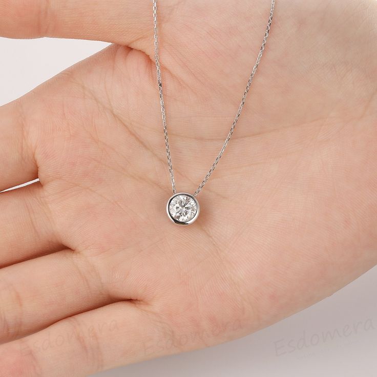 Moissanite Pendant Necklace, Round Cut 1CT Center Moissanite Bezel Solitaire 14k White Gold Pendants Necklace Chain, Moissanite Necklace ※ Metal Type: Solid 14k gold. ※ Center Stone: Esdomera Moissanite ※ Center Carat Weight: 1ct Round Cut(6.5mm); ※ Color: F; ※ Clarity: VVS1; ※ Side Stones: No Side Stones; ※ SKU: ESP0009; ※ Accessories: The white gold chain style will be random, may be different from the pictures. ※ Accessories: *Shipped with Certificate and beautiful ring box; *Certificate - fr White Pendant Necklace With Bezel Setting, White Round Solitaire Necklace With Bezel Setting, Diamond White Necklace With Bezel Setting As Gift, White Bezel Setting Necklace For Gift, Solitaire Diamond Round Necklace Gift, Round Solitaire Diamond Necklace Gift, Round Solitaire Diamond Necklace For Gift, Gift Solitaire Round Diamond Necklace, Wedding Solitaire Bezel Pendant Necklace