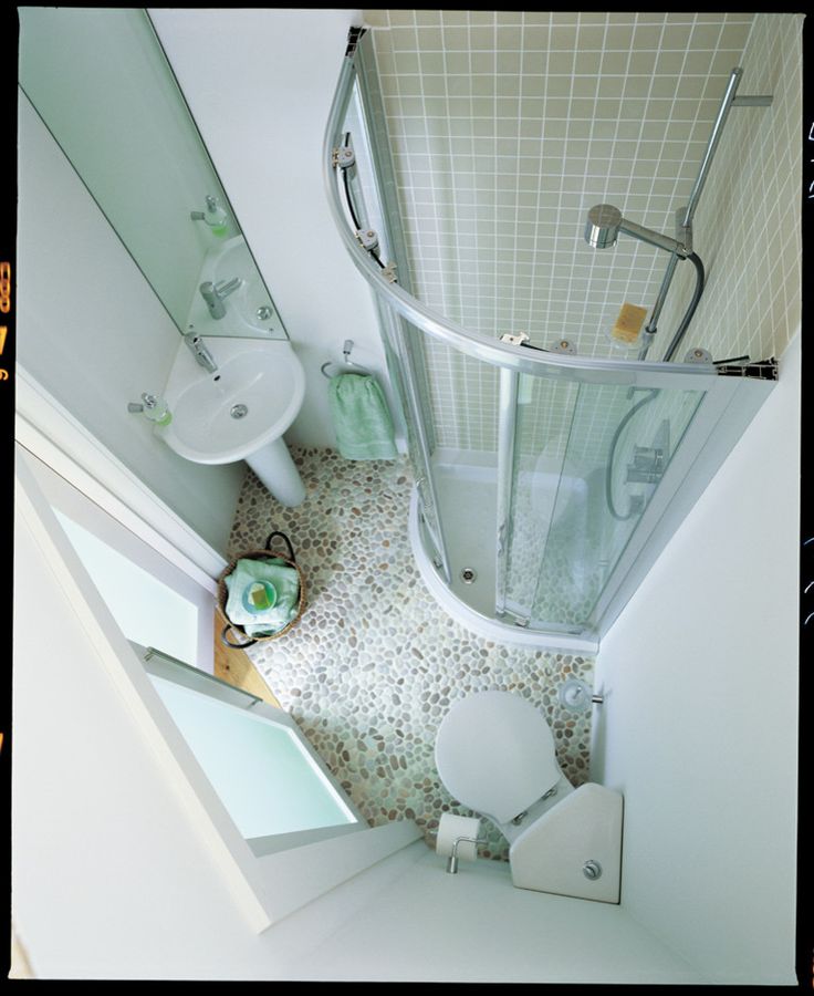 an aerial view of a bathroom with toilet, shower and sink