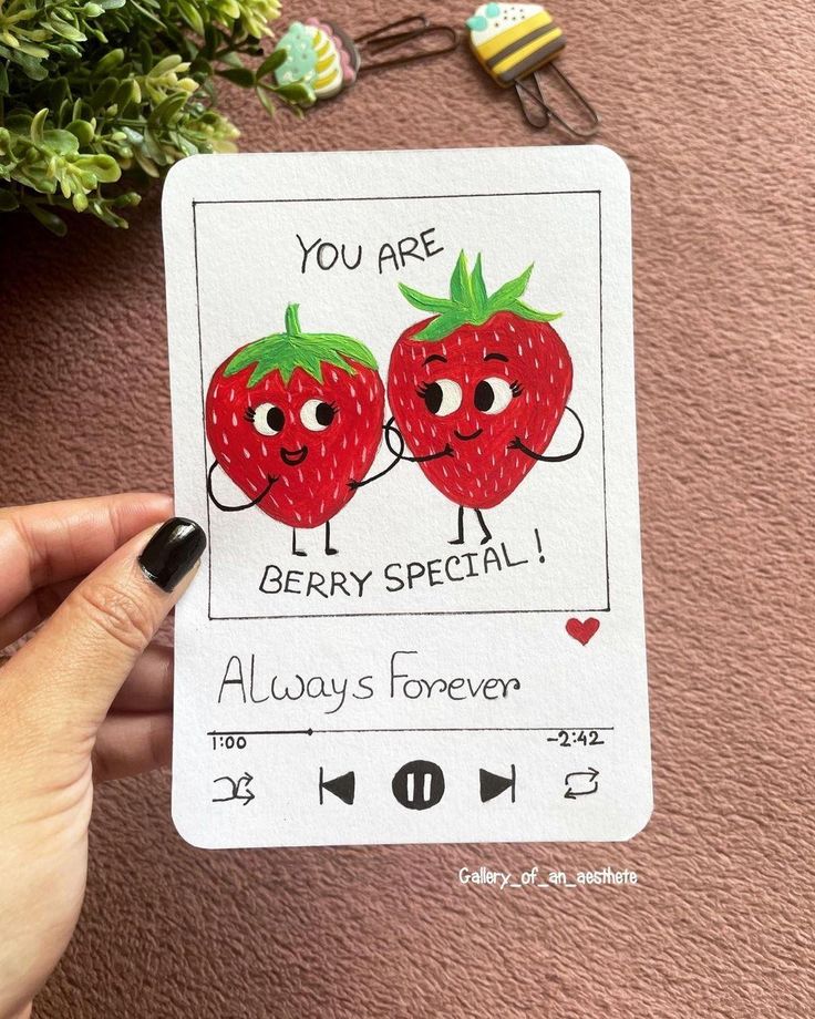 someone holding up a card with two strawberries on it and the caption you are berry special