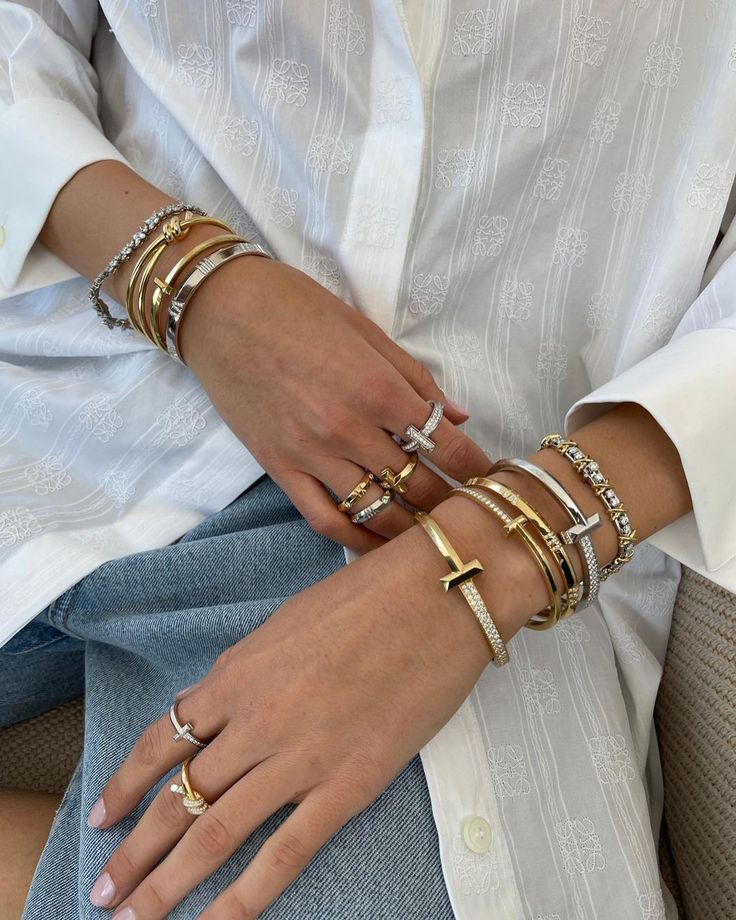 11 Luxury Pieces That Are Worth the Investment | Who What Wear UK Luxury Designer Bracelet Stack, Tiffany T Bracelet Stack, Investment Jewelry Pieces, Bracket Stack Ideas, Stack Bracelet Ideas, Stacked Bracelets Aesthetic, Tiffany Stack, How To Stack Bracelets, Bracelet Stack Aesthetic