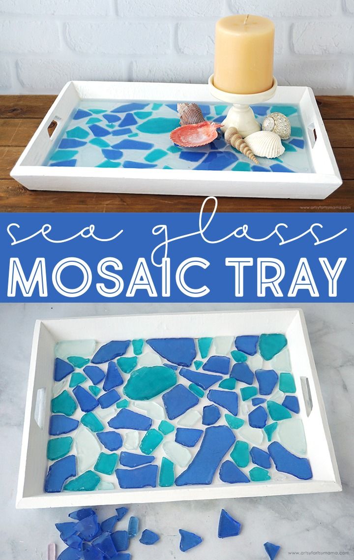 sea glass mosaic tray with blue and green pieces on it, next to a candle