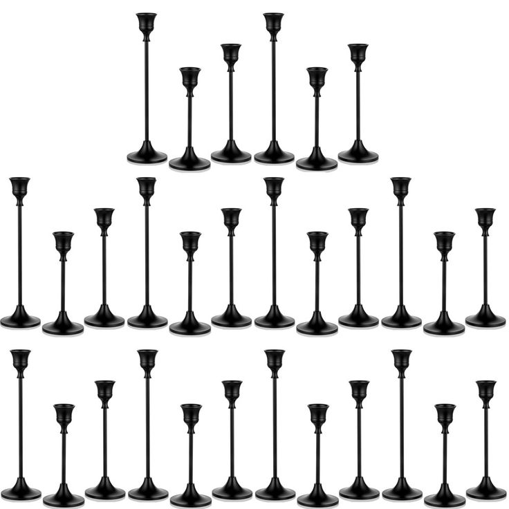 a set of black candlesticks are shown in different sizes and shapes on a white background