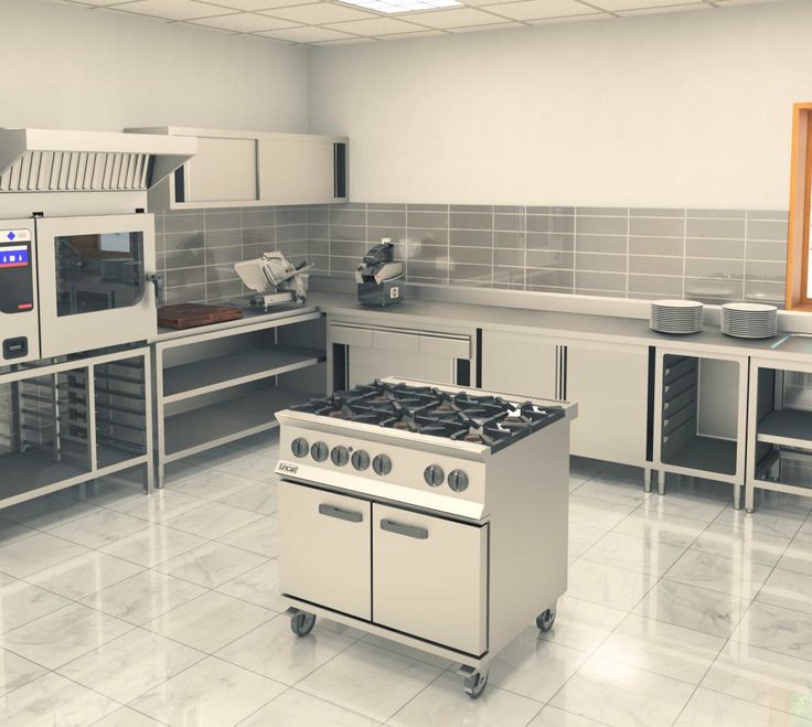 an industrial kitchen with stainless steel appliances and tile flooring is shown in this image