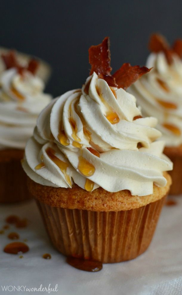 cupcakes with white frosting and bacon on top