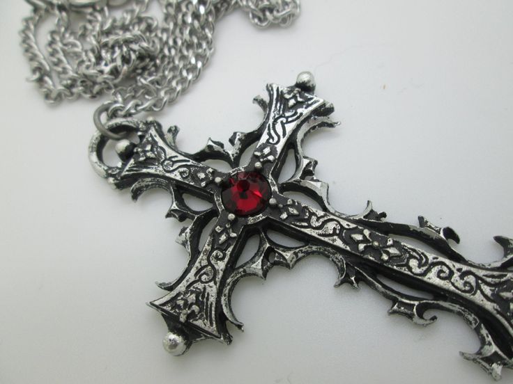 This Gothic cross necklace is an handmade pewter sculpture orned with an Austrian Swarovski or a real gem (My fav is the Black star Diopside, seriously) This gothic necklace is sold with a stainless steel chain of 18'' or 24'', if you would like to have a different length for the chain, you can write the desired length in the private note section when ordering :) This is a Gothic cross of 7cm This gothic cross necklace is a pewter sculpture of my own creation, i create and work the metal by myse Gothic Metal Cross Jewelry, Gothic Cross Metal Jewelry, Gothic Metal Cross Pendant Jewelry, Gothic Oxidized Cross Necklace, Gothic Cross Pendant Jewelry, Gothic Cross Necklace With Oxidized Finish, Medieval Silver Cross Jewelry, Gothic Metal Cross Necklace, Gothic Metal Cross Necklaces