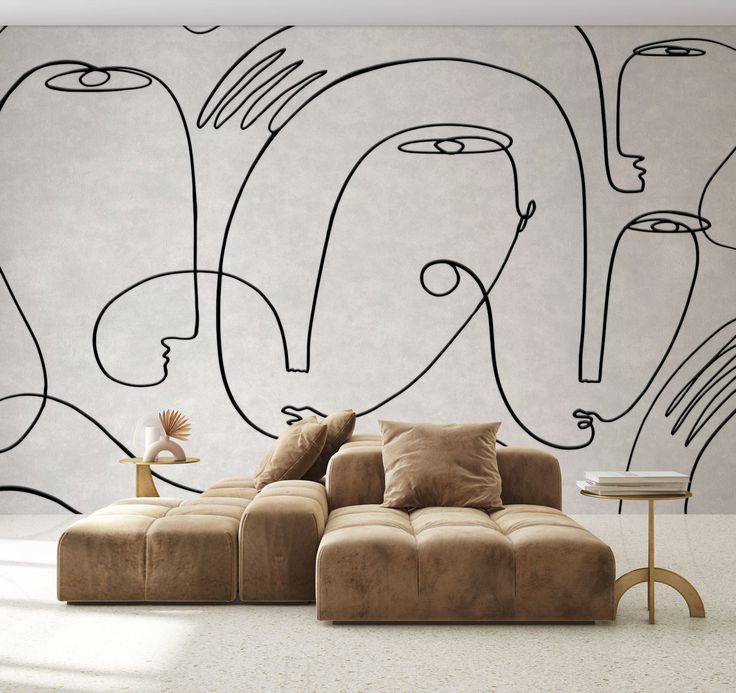 a living room with a couch, coffee table and wallpaper on the walls that has black lines drawn on it