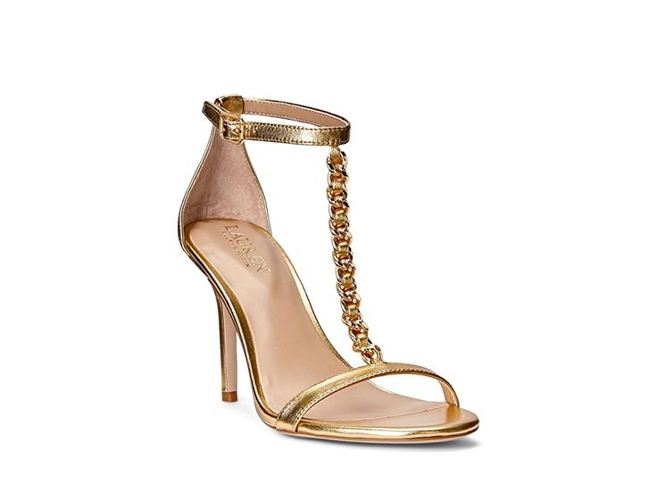 LAUREN Ralph Lauren Kate Sandal - Women's Shoes : Modern Gold : Enter the hall donning the glamorous and sleek LAUREN Ralph Lauren Kate Sandal with a t-strap design. Smooth Nappa leather upper. PU lining and soft cushioned insole. Buckled ankle strap closure. Features a glistening chain that adorns the vamp. Round toe construction. Leg-lengthening stiletto heel. Rubber outsole. Imported. Weight of footwear is based on a single item, not a pair. Lauren Kate, Ralph Lauren Shoes, Leather Slide Sandals, Ankle Strap Pumps, Gold Heels, Footwear Design Women, Ralph Lauren Womens, Dress Sandals, Gold Leather