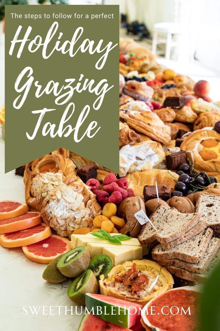 a table filled with lots of different types of food and the words holiday grazing table